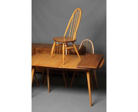 AN ERCOL LIGHT ELM DINING SUITE, mid 20th century, comprising sideboard, the fascia with three central drawers with oval wood