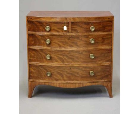 A REGENCY MAHOGANY BOWED CHEST, early 19th century, the caddy top over string inlaid frieze, two short over three long drawer