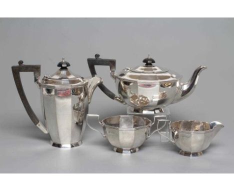 A SILVER FOUR PIECE TEA AND COFFEE SERVICE, by Walker &amp; Hall, Sheffield 1924, of panelled circular form with cast and app