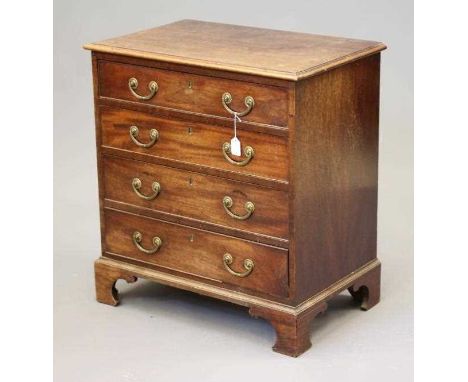 A SMALL MAHOGANY STRAIGHT FRONT CHEST, the moulded edged top over four graduated cock beaded drawers with brass drop handles,