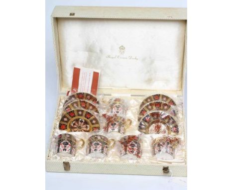 A ROYAL CROWN DERBY CHINA CABINET COFFEE SET, c.1974, painted in the Imari palette with pattern 1128 and comprising six each 