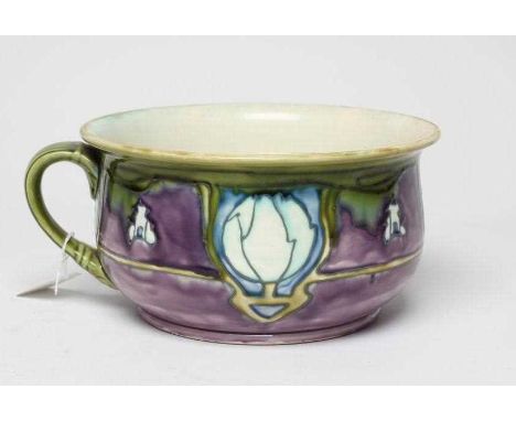 A MINTONS LTD. EARTHENWARE SECESSIONIST CHAMBERPOT, c.1900, tubelined and painted in shades of green, white, purple and blue 