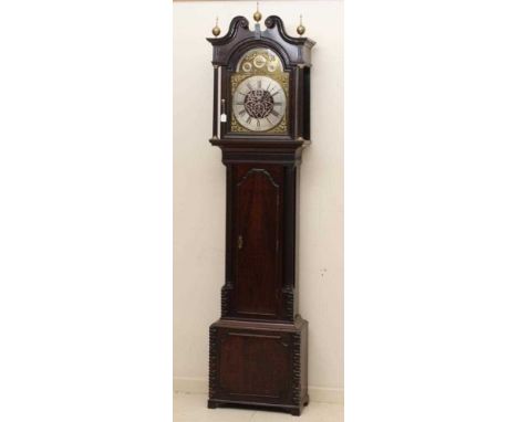 A MAHOGANY CHIMING LONGCASE CLOCK, the triple weight movement quarter chiming on eight bells, 14 1/2" arched brass dial with 