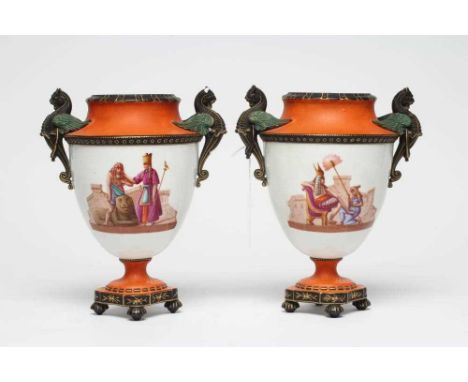 A PAIR OF FRENCH WHITE OPAQUE GLASS EMPIRE STYLE URNS, mid 19th century, the swept shoulders with two winged mythical beast r