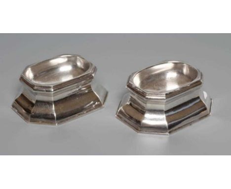 A PAIR OF GEORGE II SILVER TRENCHER SALTS, by Edward Wood, London 1733, of plain swept canted oblong form, engraved M*A over 