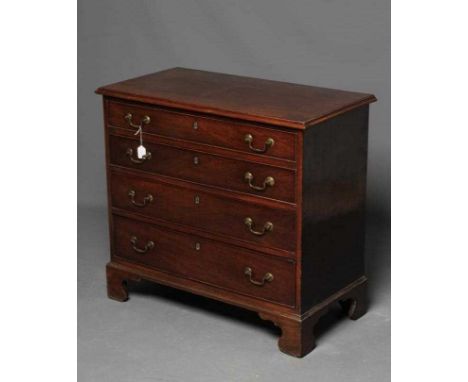 A GEORGIAN MAHOGANY STRAIGHT FRONT CHEST, late 18th century, the moulded edged top over four graduated cock beaded drawers wi