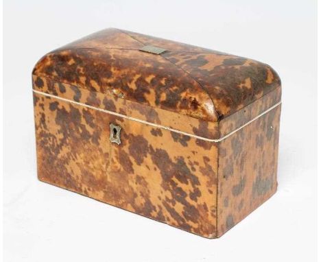 A TORTOISESHELL TEA CADDY, early 19th century, of oblong form, the hinged lid enclosing two compartments, with ivory trim, 4 