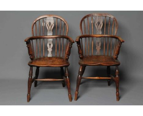 A MATCHED PAIR OF ASH AND ELM WINDSOR ARMCHAIRS, Lincolnshire, mid/late 19th century, of low hoop back form with fleur de lys