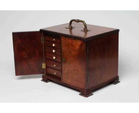 A VICTORIAN MAHOGANY SPECIMEN CABINET of oblong form with reeded edging, two doors enclosing seven graduated drawers with blu