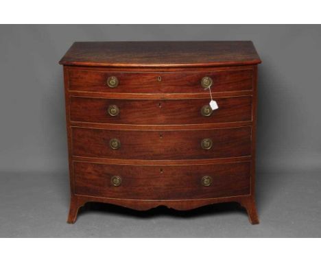A GEORGIAN MAHOGANY BOWED CHEST, late 18th century, the moulded edged top over four long graduated drawers with brass ring ha