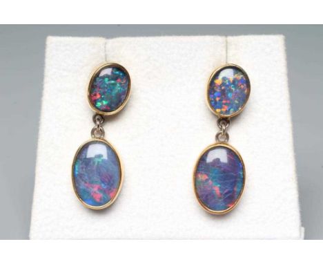 A PAIR OF BLACK OPAL STUD EAR DROPS, the two graduated oval polished cabochons link tied to screw posts, unmarked, with butte