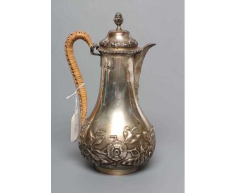 A LATE VICTORIAN ART NOUVEAU SILVER HOT WATER JUG, by Holland, Aldwinckle &amp; Slater, London 1896, of slender baluster form