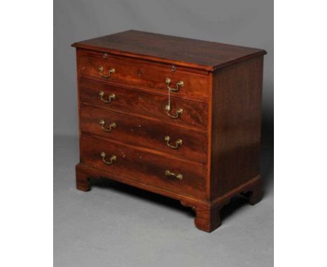 A GEORGIAN MAHOGANY STRAIGHT FRONT CHEST, third quarter 18th century, the moulded edge and banded top over a slide, four grad