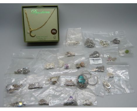 Twenty four silver pendants and chains, a silver gilt pendant and a chain with box 