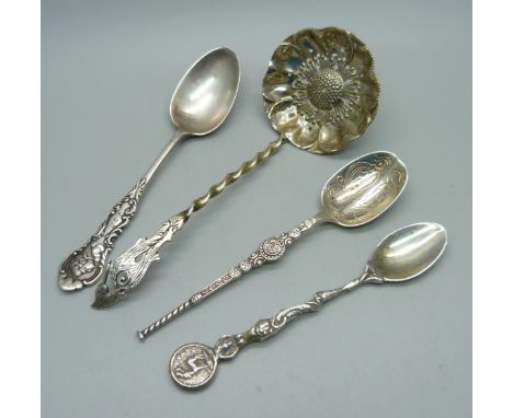A silver sifter ladle with stork finial and three other silver spoons, 57g 