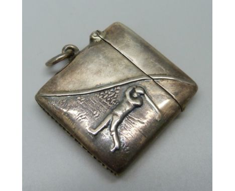 A silver vesta case with golfing scene 