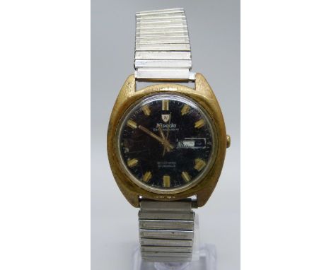 A Nivada Compensamatic black dial day/date wristwatch with sweep second hand, a/f, date marker loose 
