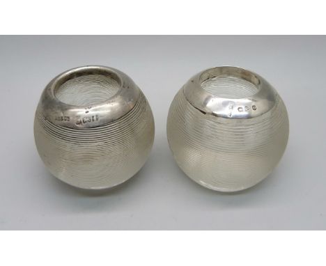 Two silver topped glass match strikers 