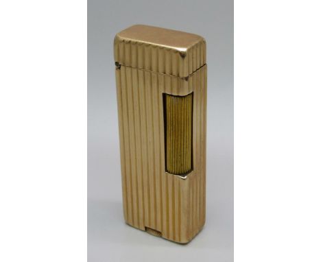 A Dunhill Rollalite 14k outer jacket petrol lighter 