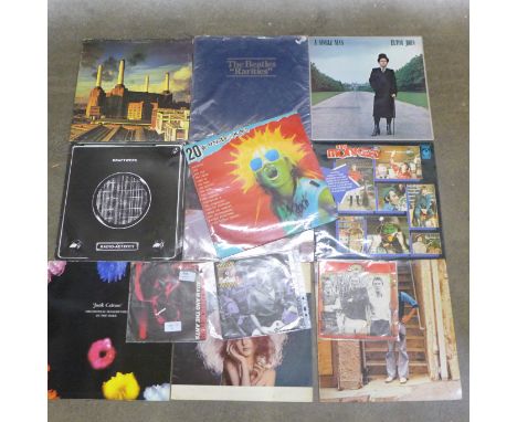 A collection of LP records including The Beatles Rarities, Elton John, Kraftwerk, Bob Dylan, etc., and three singles, The Cla