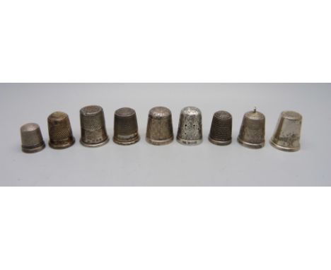 Nine silver thimbles 