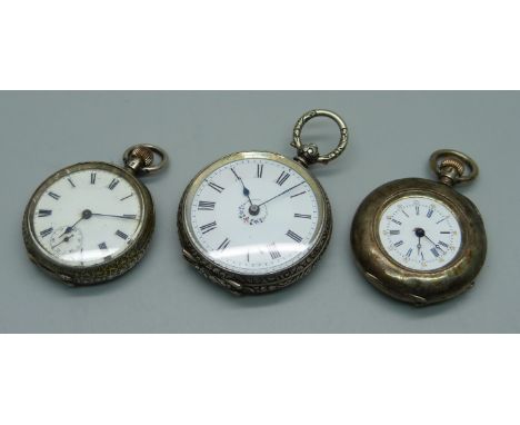 Three silver fob watches, one lacking glass 
