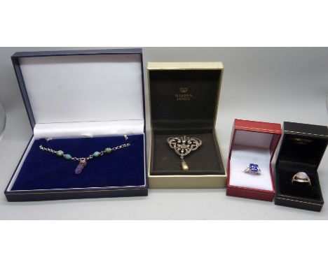 A silver and amethyst/turquoise necklace, a silver moonstone ring, a silver/marcasite brooch and a silver amethyst ring 