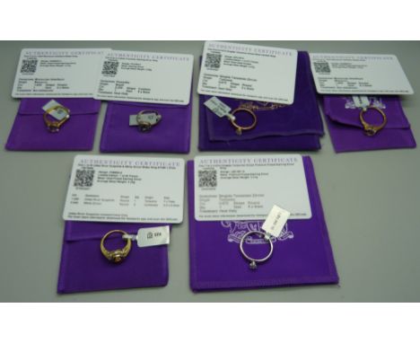 A collection of six silver and silver gilt gemstone set rings with certificates 
