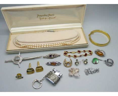 A small collection of costume jewellery including silver and amber brooches, marcasite earrings, etc. 