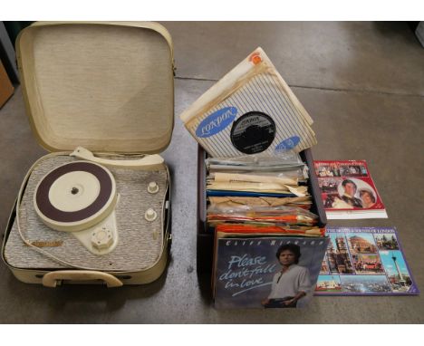 A Westminster suitcase record player with a box of 7" singles, 1960s **PLEASE NOTE THIS LOT IS NOT ELIGIBLE FOR IN-HOUSE POST