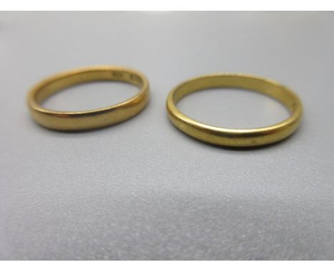 two 22ct yellow gold wedding bands, sizes L1/2 and M, both stamped 22, 5.2g 