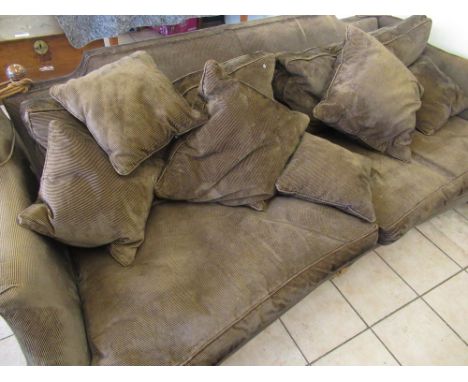 Large Knoll style three seater sofa, upholstered in brown cord with loose back, seat and scatter cushions, on square supports