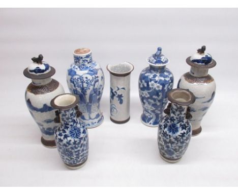 Pair of Chinese Qing lidded vases set with dogs of foe H29cm, Chinese Qing blue and white prunus pattern lidded vase H25cm, s