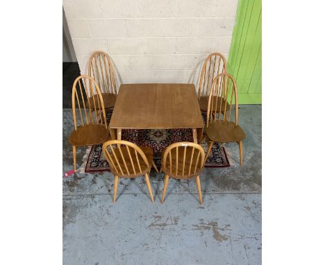 Ercol light elm drop leaf dining table, on outsplayed square tapered supports, L147cm W90cm H70cm (adapted) and a set of six 