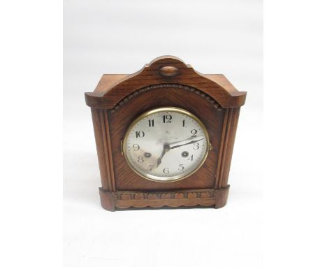 H.A.C C20th oak cased chiming mantle clock, silvered dial with makers logo striking on a scroll gong, movement stamped with m