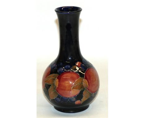 Moorcroft Pomegranate bottle shaped vase, blue ground, H24cm, with two drilled holes, previously used as a lamp 