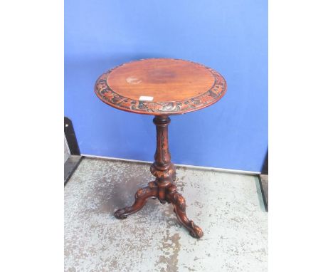 Victorian carved walnut tripod table, circular top on vase turned column and scroll legs, D43cm H70cm 