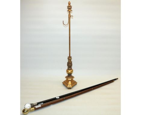 Novelty sectional walking cane, brass handle with compass and glass tube, an ebonised walking cane with facet cut glass handl