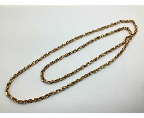 Trifari; A Vintage Gilt Metal Long Chain, suspending small gilt metal hand tag.