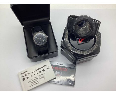 Casio; A Modern G-Shock wristwatch, with user guide and warranty card, boxed, together with a Swatch watch. (2)