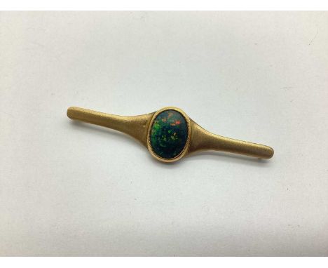 A Black Opal (Doublet?) Set Bar Brooch, oval cabochon collet set within polished bezel and tapering satin finish bar brooch (