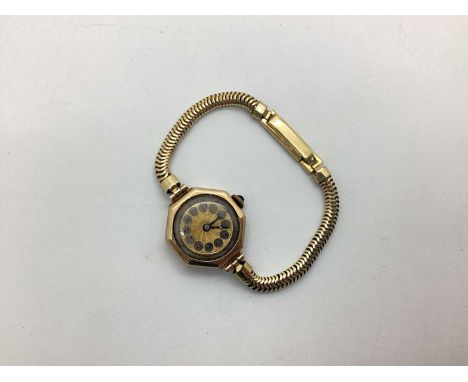 A Vintage Ladies Wristwatch, the unsigned decorative dial with Arabic numerals, within an octagonal plain case stamped "9 375