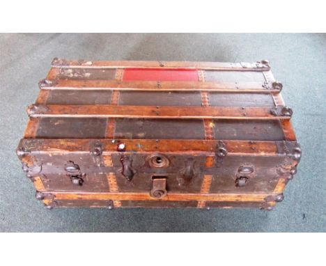 A METAL BOUND CANVAS TRAVELLING TRUNK 85cm wide, 48cm deep, 35cm high