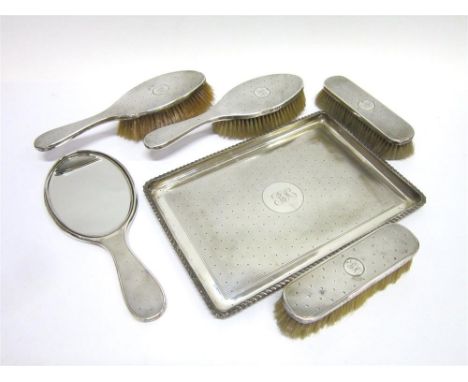 A SILVER DRESSING TABLE TRAY by Stoke and Ireland Ltd, London 1905, of rectangular outline, engine turned linear and dot deco