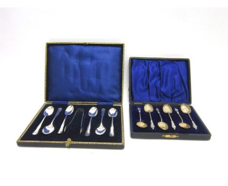 A CASED SET OF SIX SILVER TEASPOONS with tongs, by William Hutton & Sons, Sheffield 1916; with a cased set of six silver teas