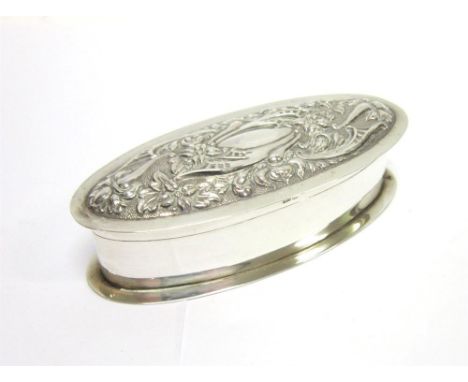 A SILVER TRINKET BOX by William Hutton & Son Ltd, Birmingham 1910, of elongated oval outline, with a rococo style embossed hi