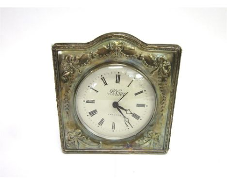 A SILVER FRONTED MANTLE CLOCK By R. Carr, Sheffield 1993, of square arched top shaped, decorated with garlands and ribbon bow