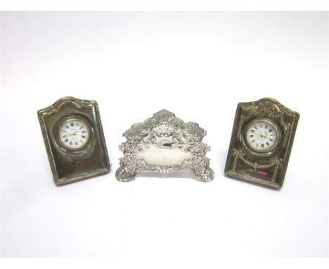 A SILVER FRONTED BOUDOIR CLOCK By R. Carr, Sheffield 1994 of rectangular arched top shape, decorated with garlands and ribbon