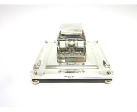A SILVER STANDISH  By Goldsmiths, Silversmith Co Ltd, London 1968, of square outline, the borders formed by pen wells, on bun