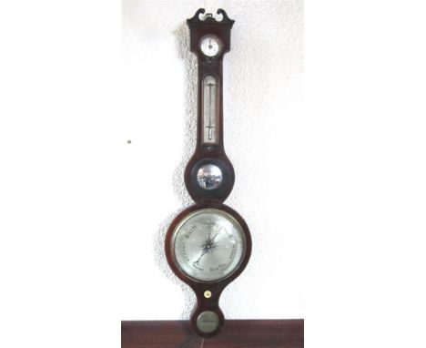 A MAHOGANY WHEEL BAROMETER, P. NOLFI, TAUNTON with a circular silvered dial, the case with swan's neck pediment and set with 